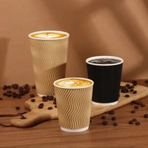 Ripple wall paper coffee cups with hot latte and black coffee on wooden table with coffee beans.