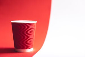 disposable paper cup in trendy color viva magenta.